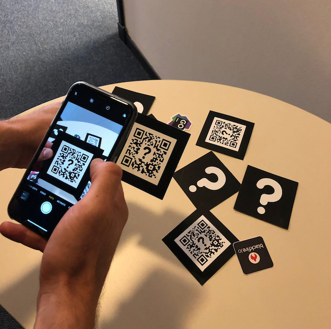 Phone scanning a QR code card